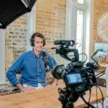 man films on camera