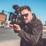 man films on camera