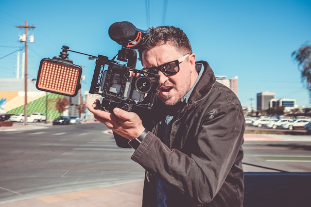 man films on camera